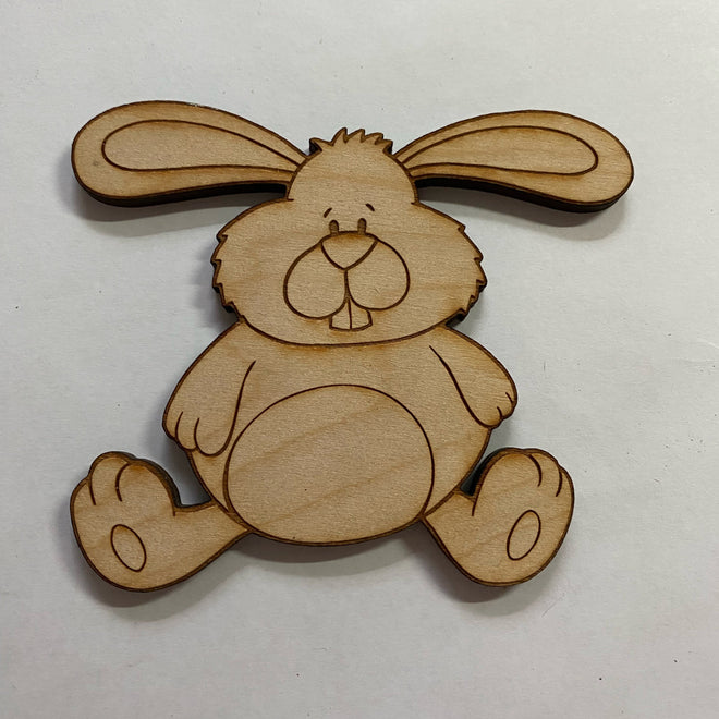 Wooden rabbit-shaped cutout on a white background