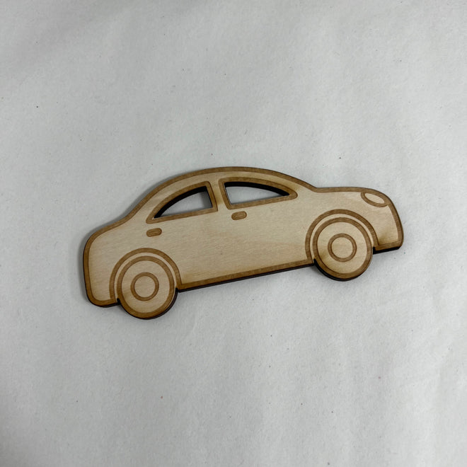 Car-shaped wooden object on a white background