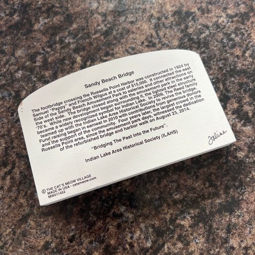 White back with text on a brown granite surface