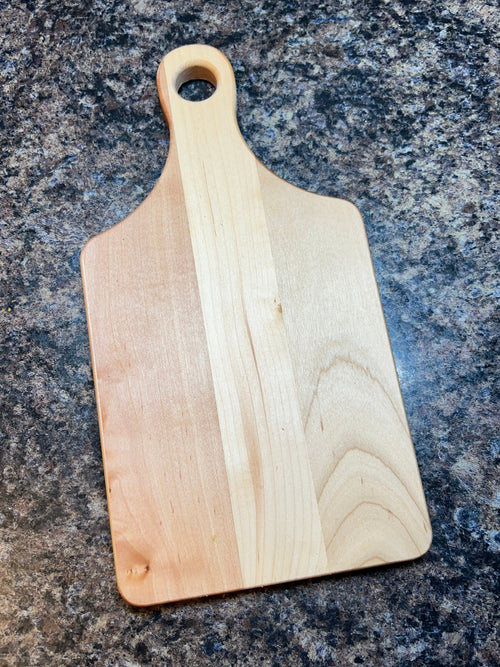 Wooden cutting board on a granite countertop