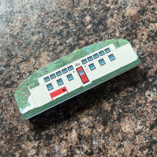 Model of the Ark Restaurant on a brown surface