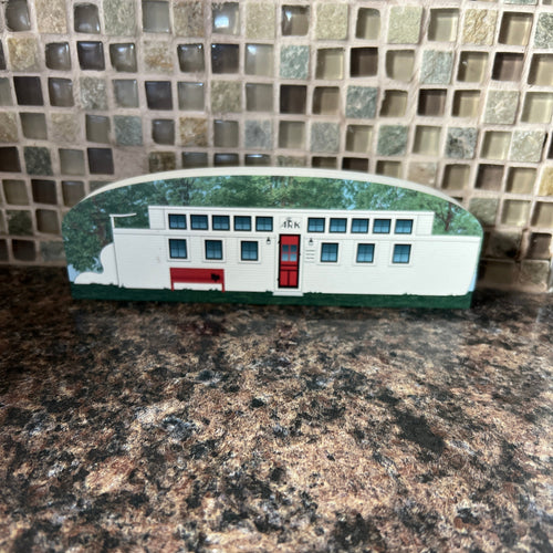 Front of Ark Restaurant with a decorative frame on a textured surface